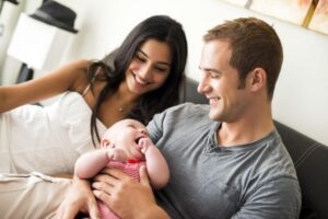 Seminole Adoption Attorneys happy couple with baby 768x512 2 300x200