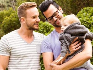 St. Petersburg Adoption Attorneys happy male couple with child 300x225